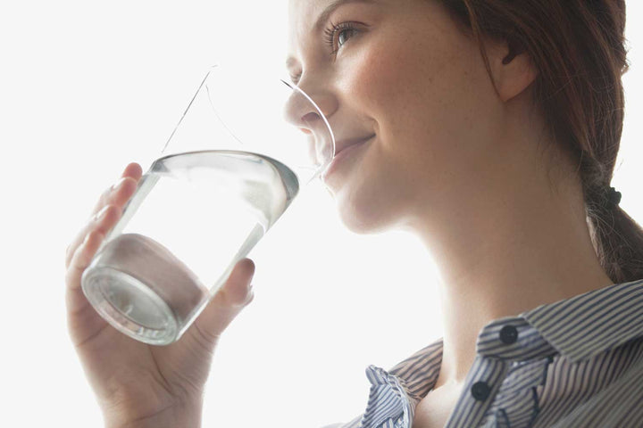 Glasses and bottles representing common types of drinking water