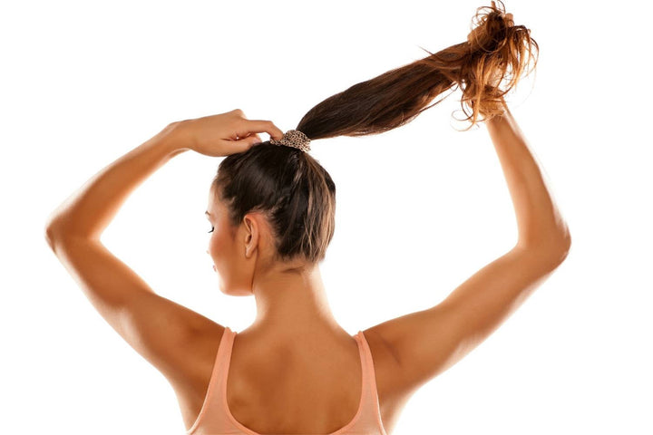 Loose ponytail style that reduces tension on the hairline